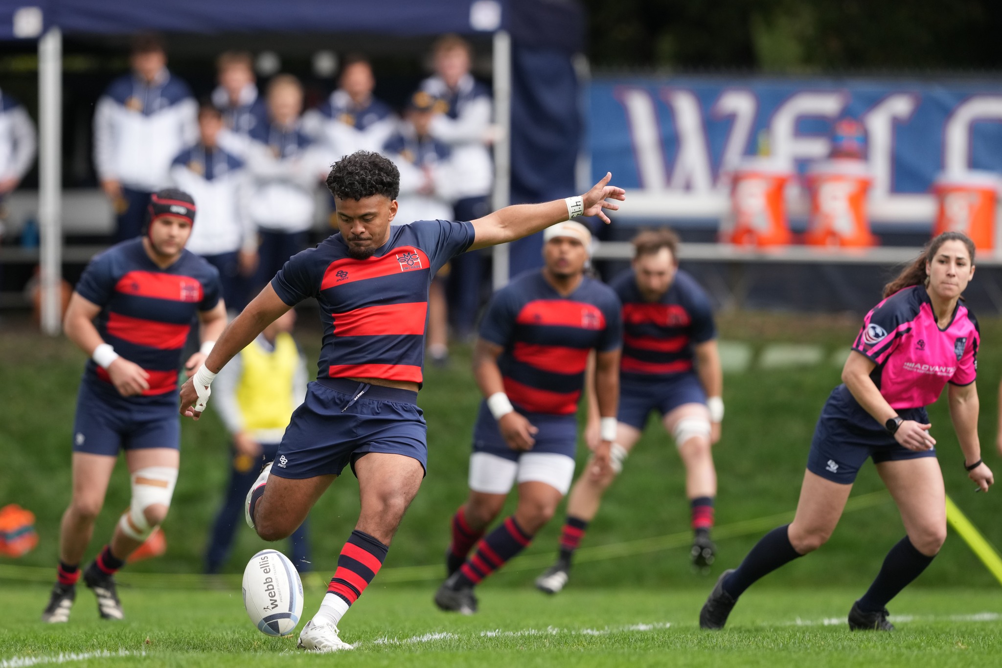 Gaels rugby players kick against Cal, 2024
