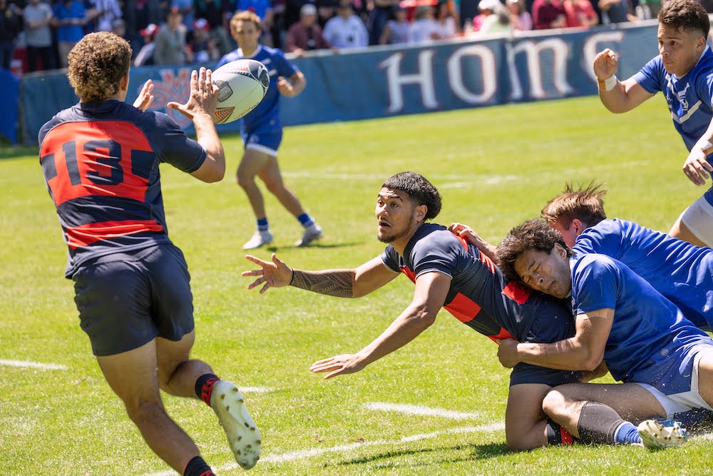 Men's rugby player Iosefa Toia'ivao passes to No.13 Erich Storti, while BYU defenders try to stop him, April 2024