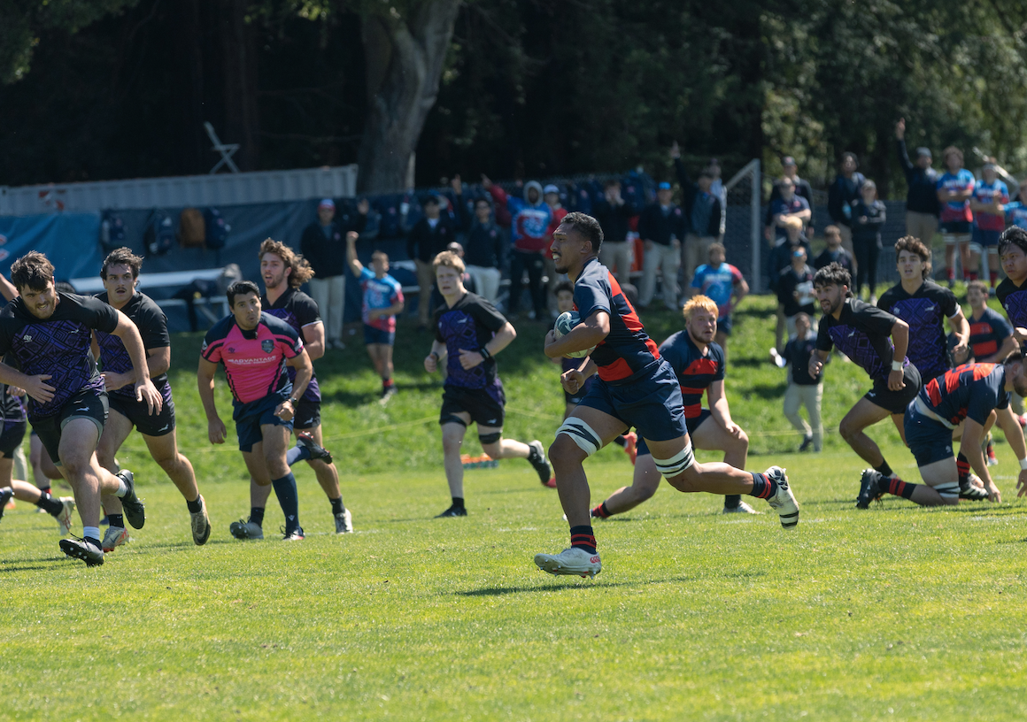 Sione Ofa runs to the try line during the Men's rugby Match