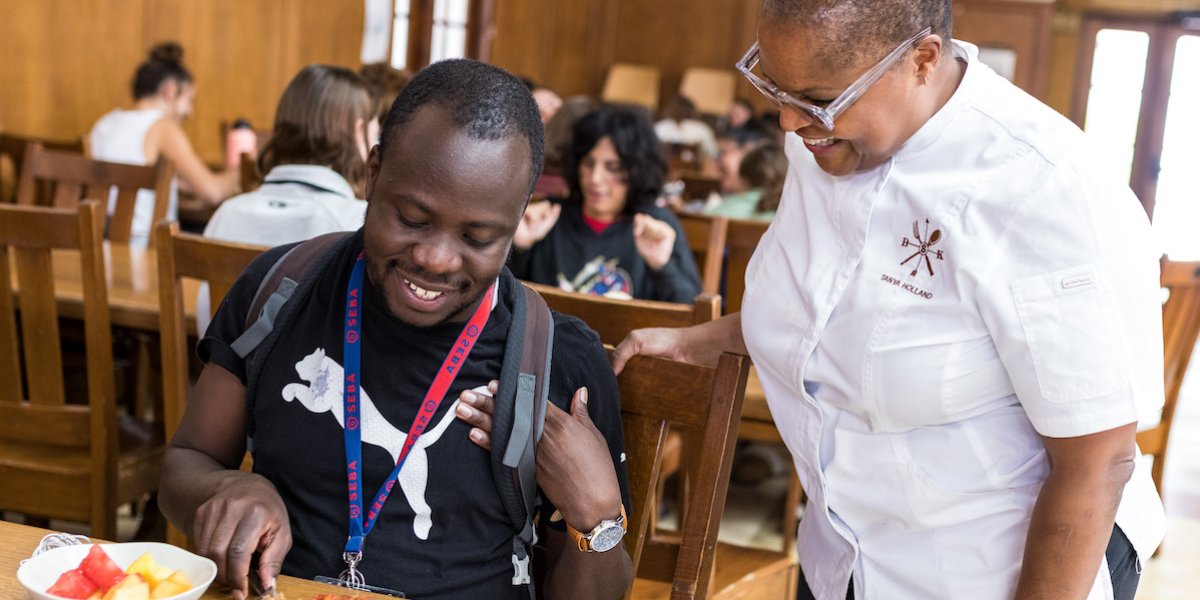 Student Brian Muganda and Chef Tanya Holland in Oliver Hall in September 2022