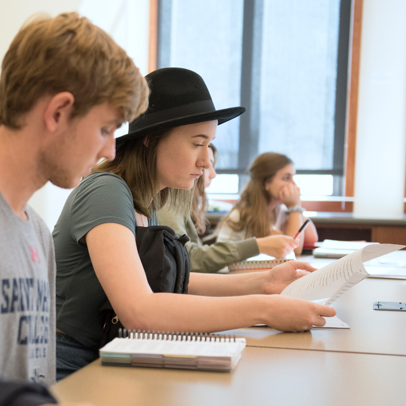 Students sitting in class looking at papers