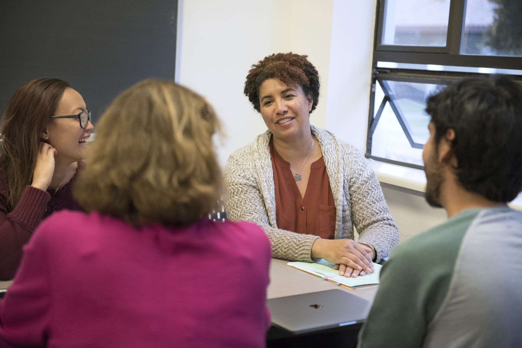 A professor is talking to students