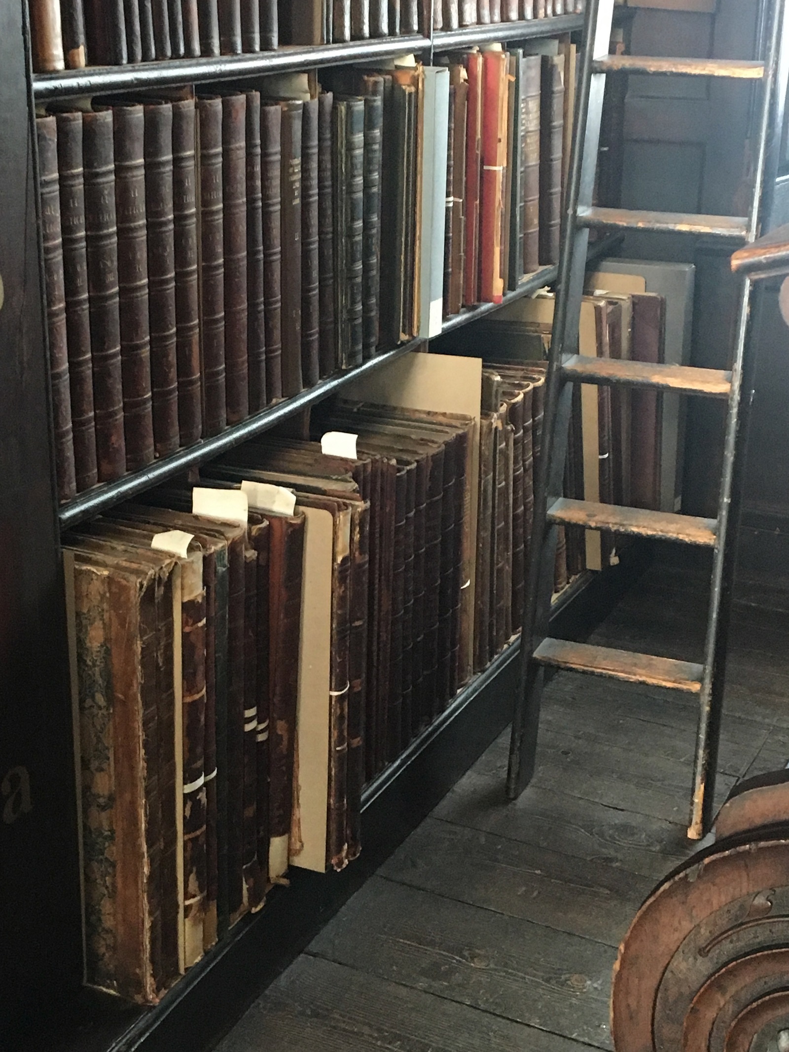 Shelves of old books in a library