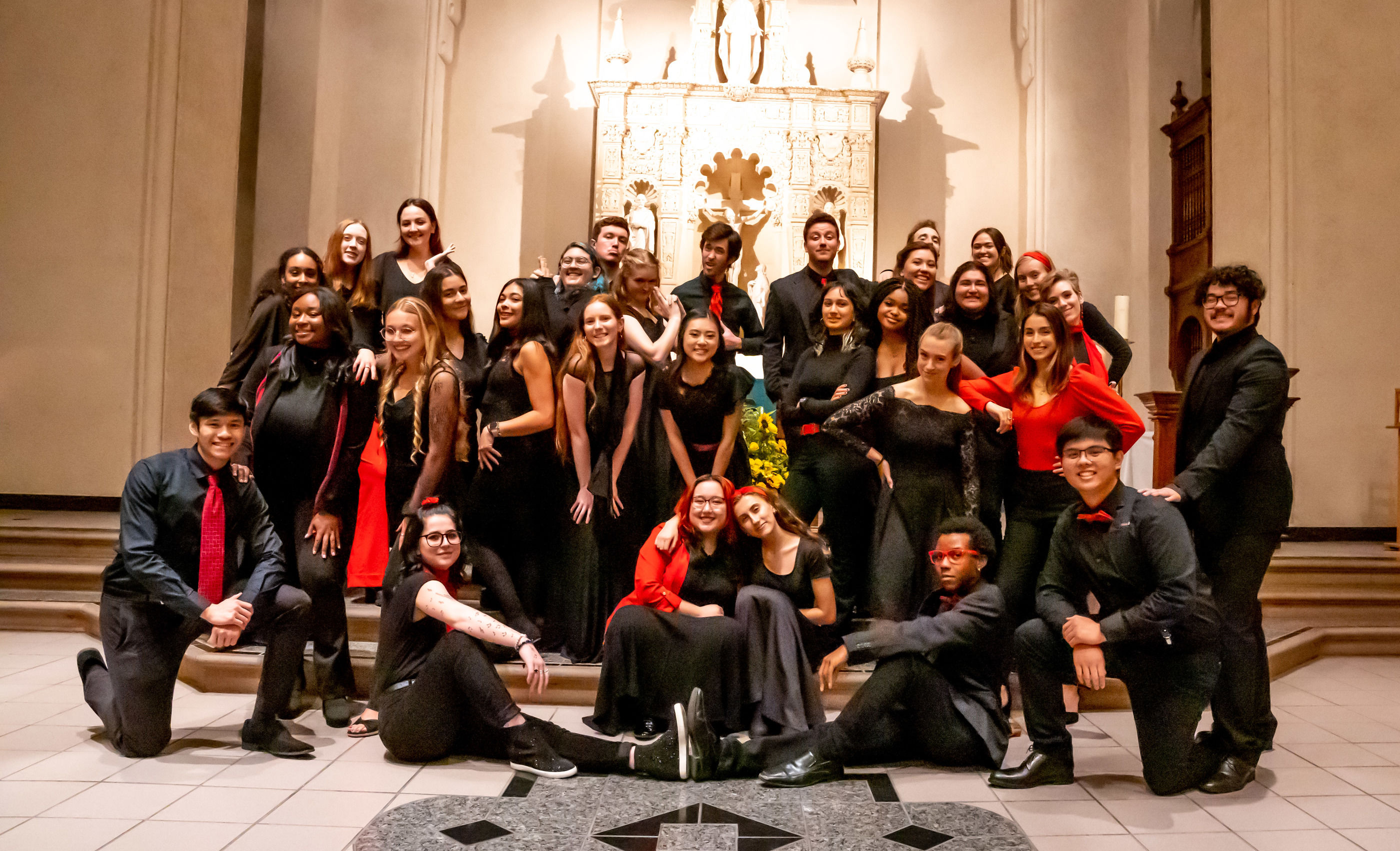 Choir students posing in the chapel