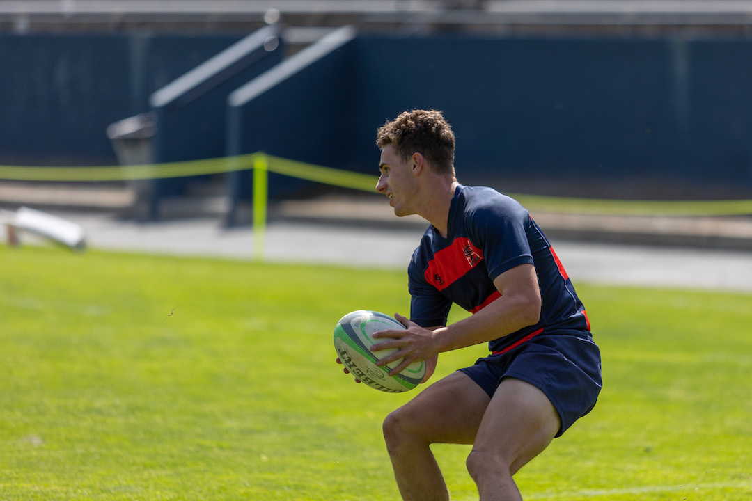 A Saint Mary's rugby player holding the ball