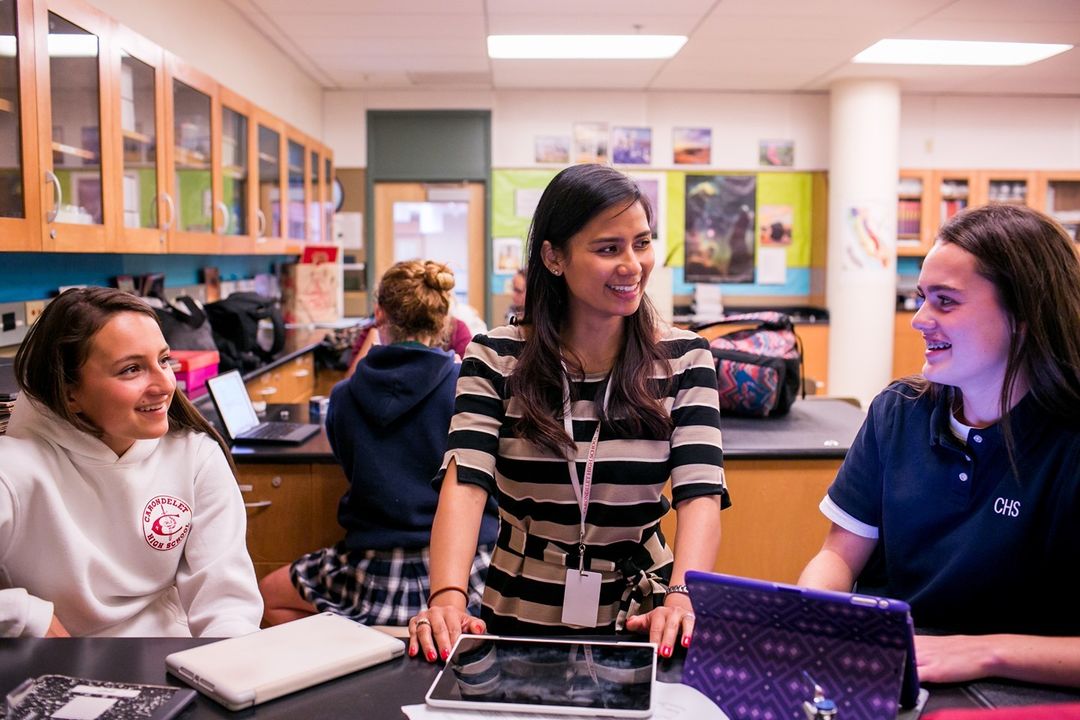A teacher with students in a classroom
