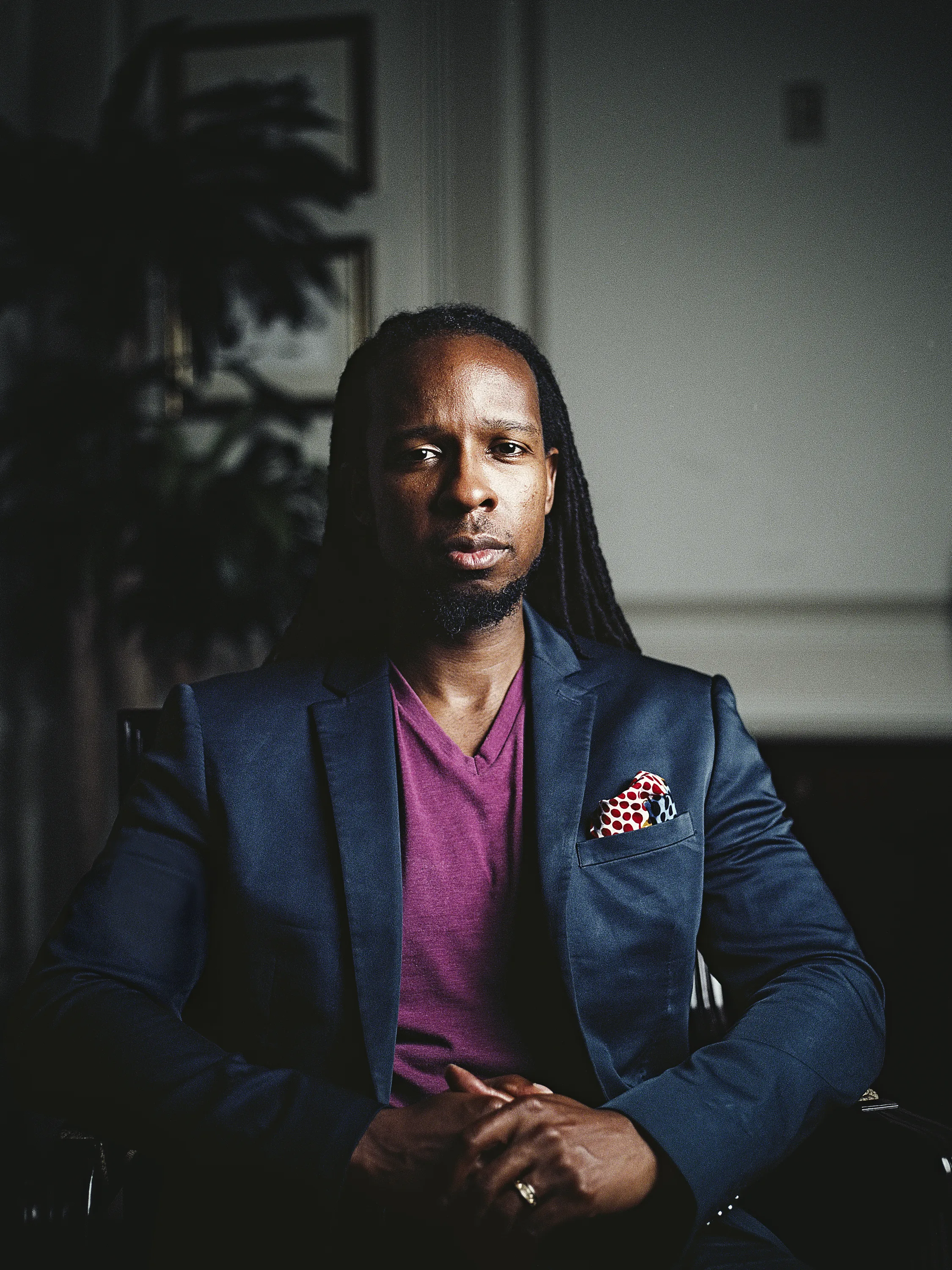 Ibram X Kendi sitting Ibram X Kendi sitting