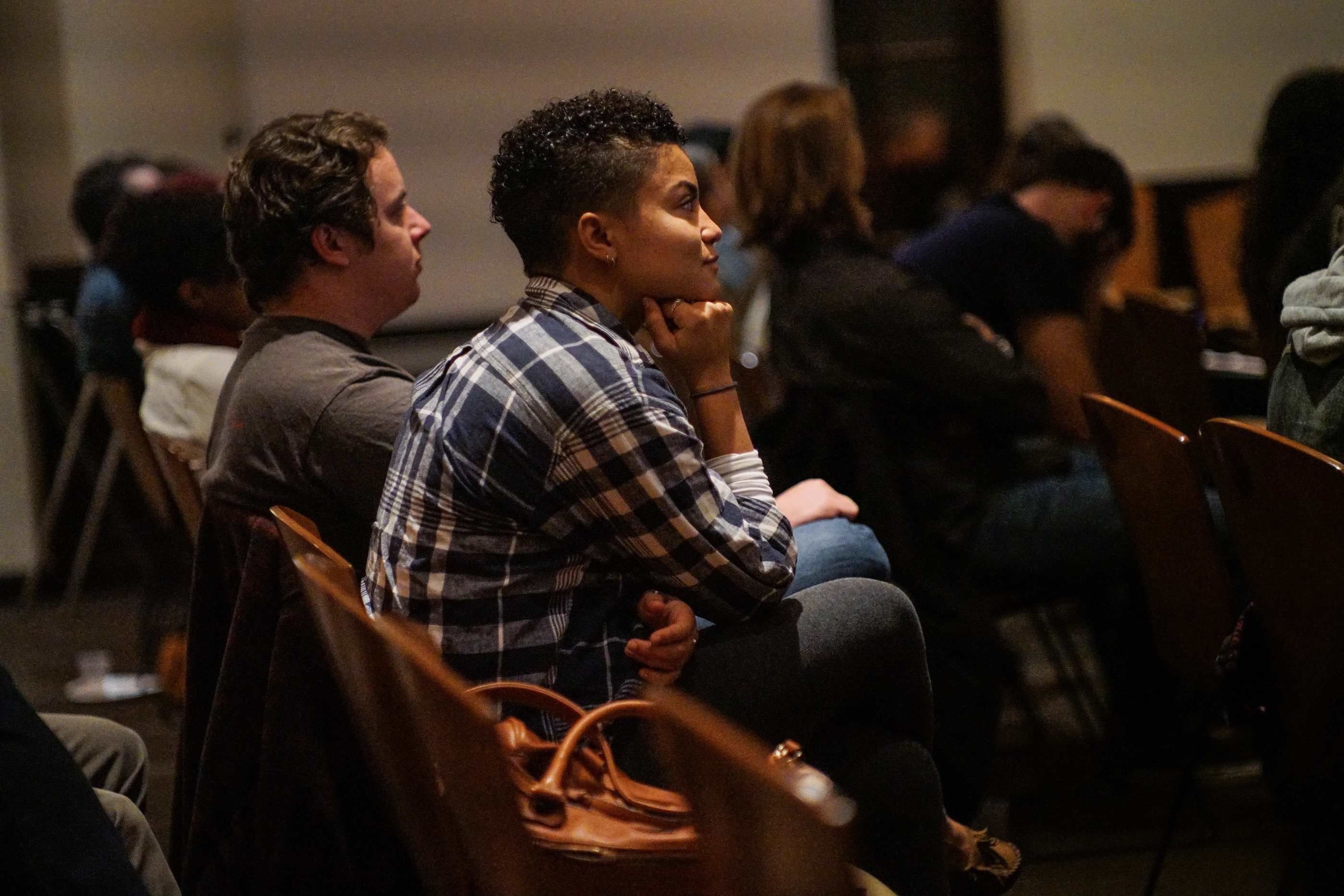 A student watches a craft talk.