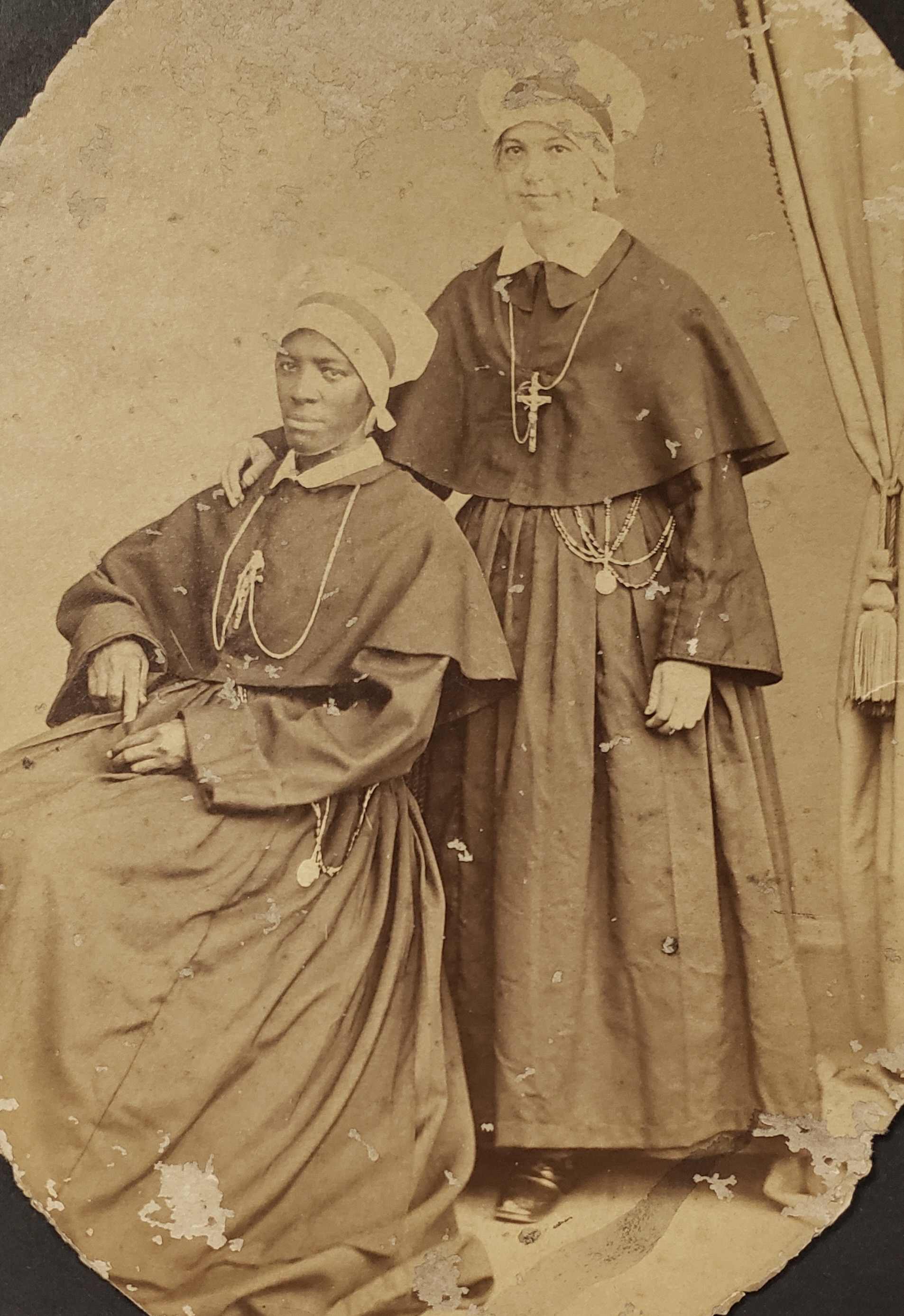 Sister M. Theodore Riley (seated) and Sister Virginia Reister (standing), c. 1860s