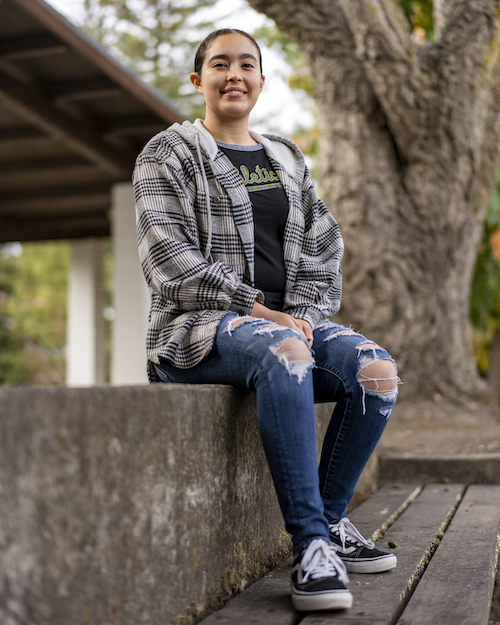 Angela Garcia seated on bench