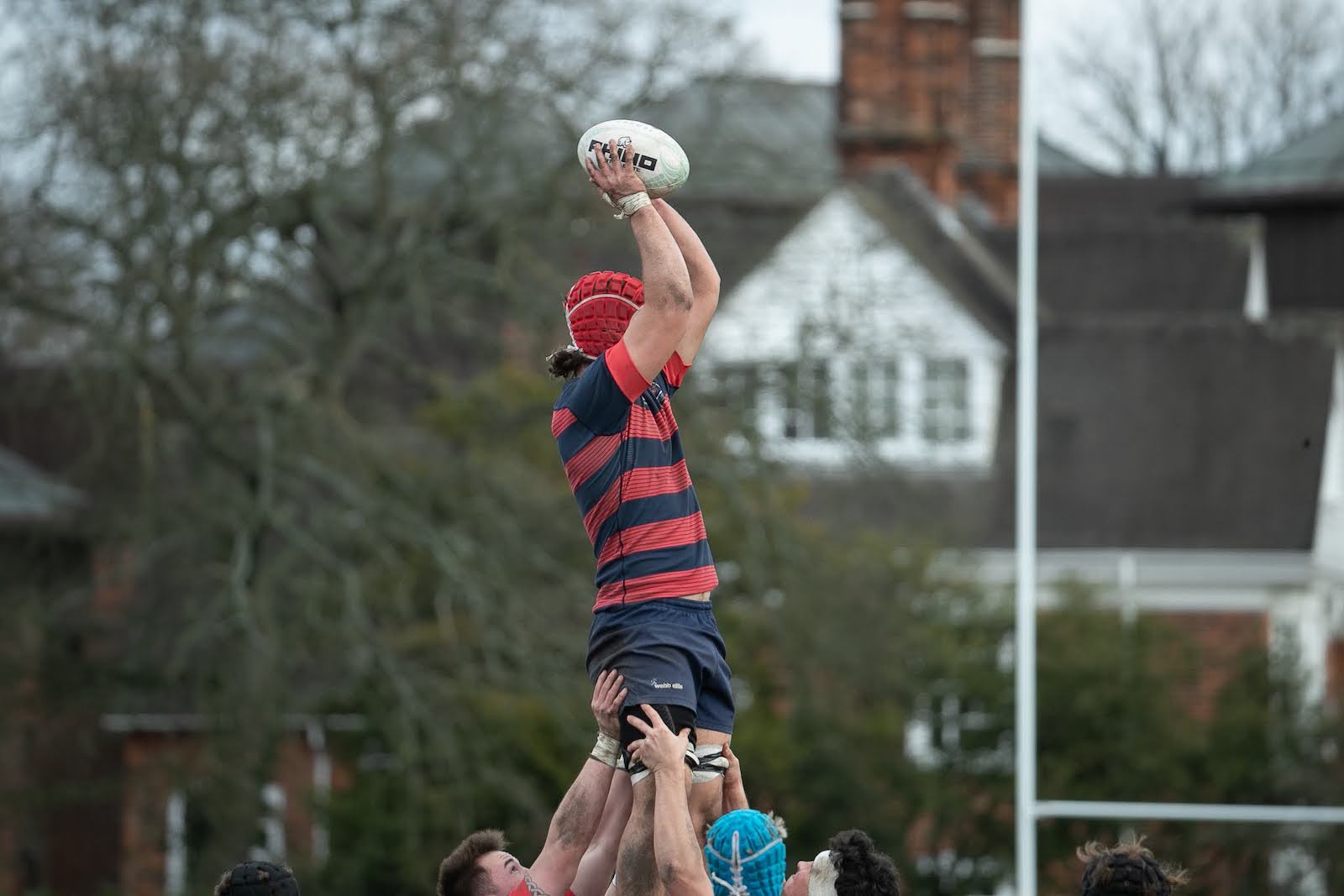 SMC Rugby player holding a ball in a game against Cambridge