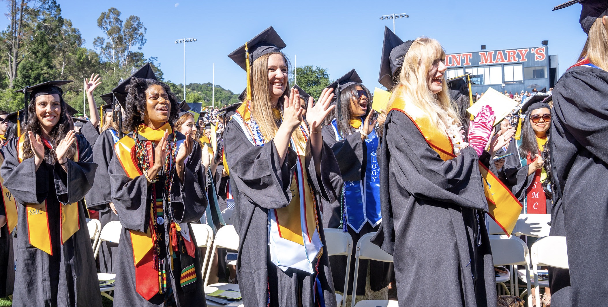 Students at graduation clapping