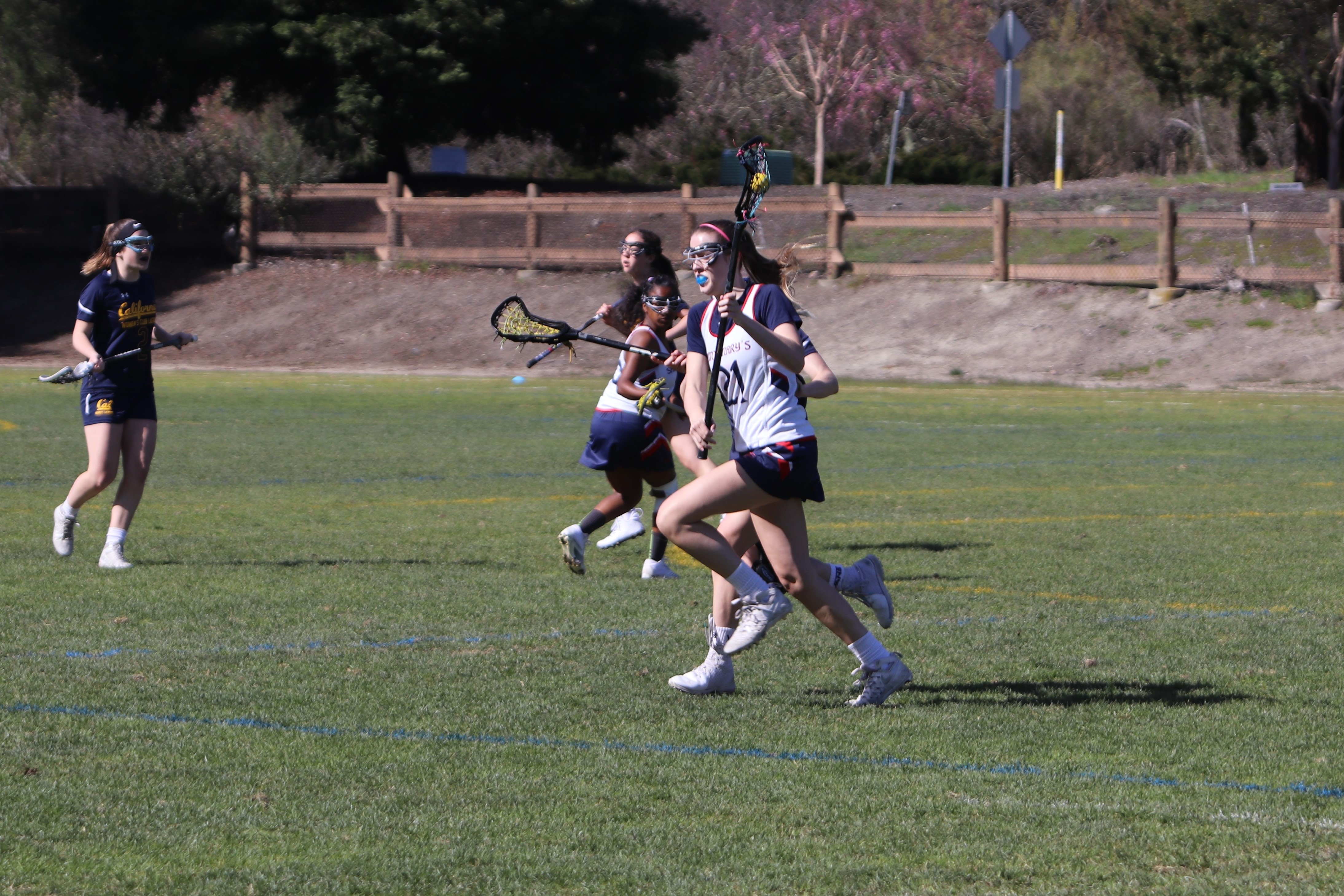 Leading scorer Lillian O'Keefe runs it up the field