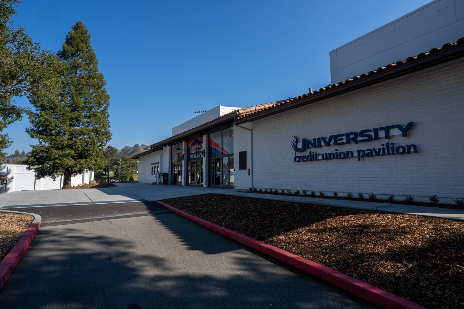 front of building with trees and walkway