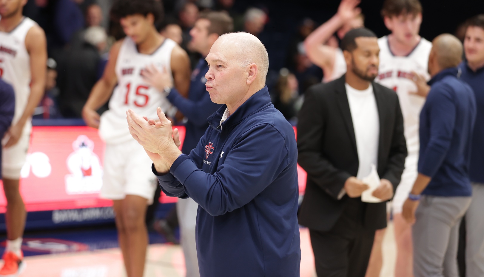 Randy Bennett claps during pregame introductions