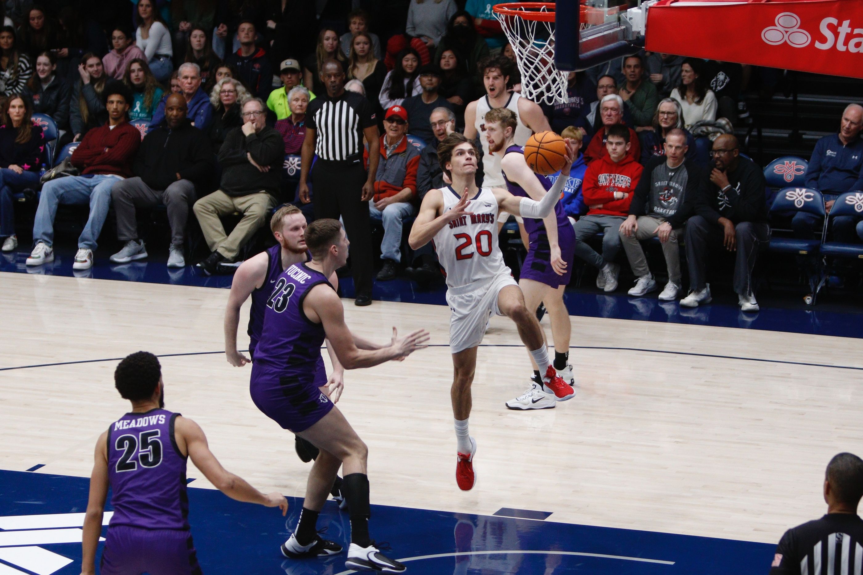Aidan Mahaney goes for a layup against Portland