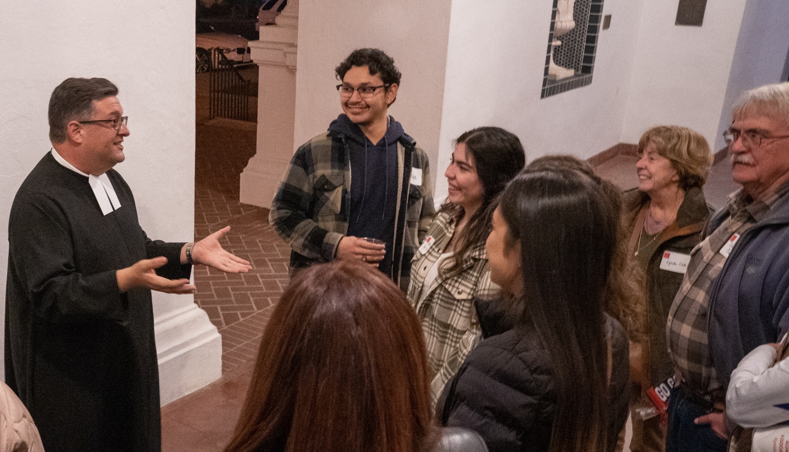 Brother David Caretti speaks with a group during the Brews & Boos Event
