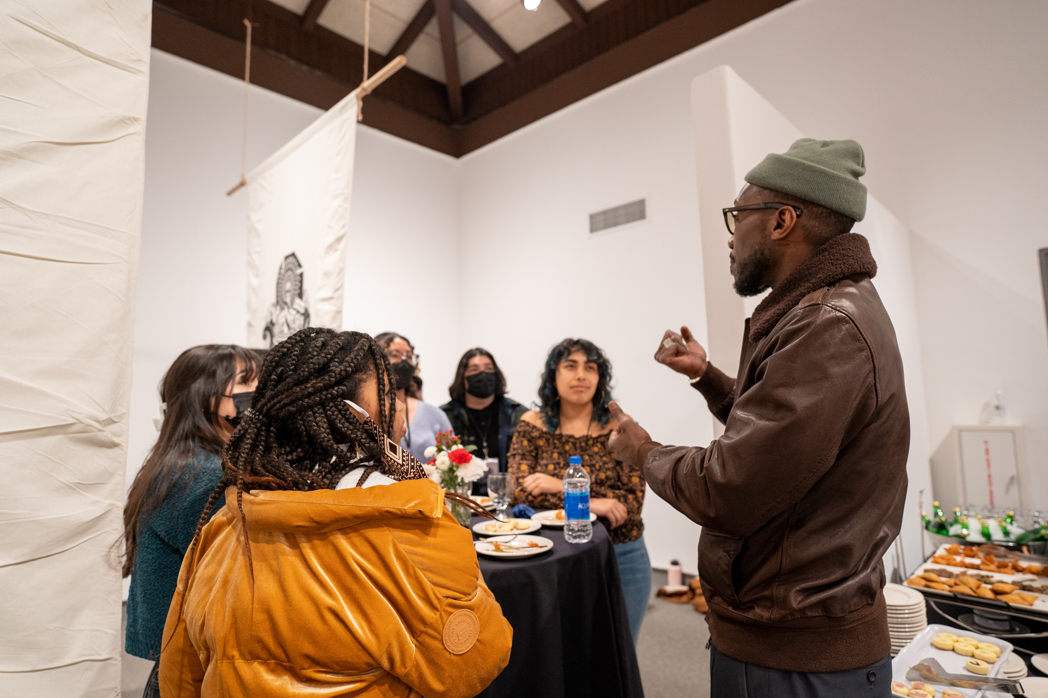 Mahershala Ali speaking to students in the museum