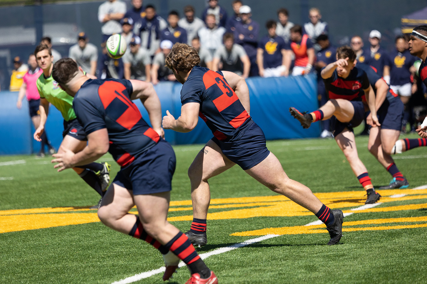 Three Saint Mary's men's rugby players in a kickoff against UC Berkeley on March 25, 2023