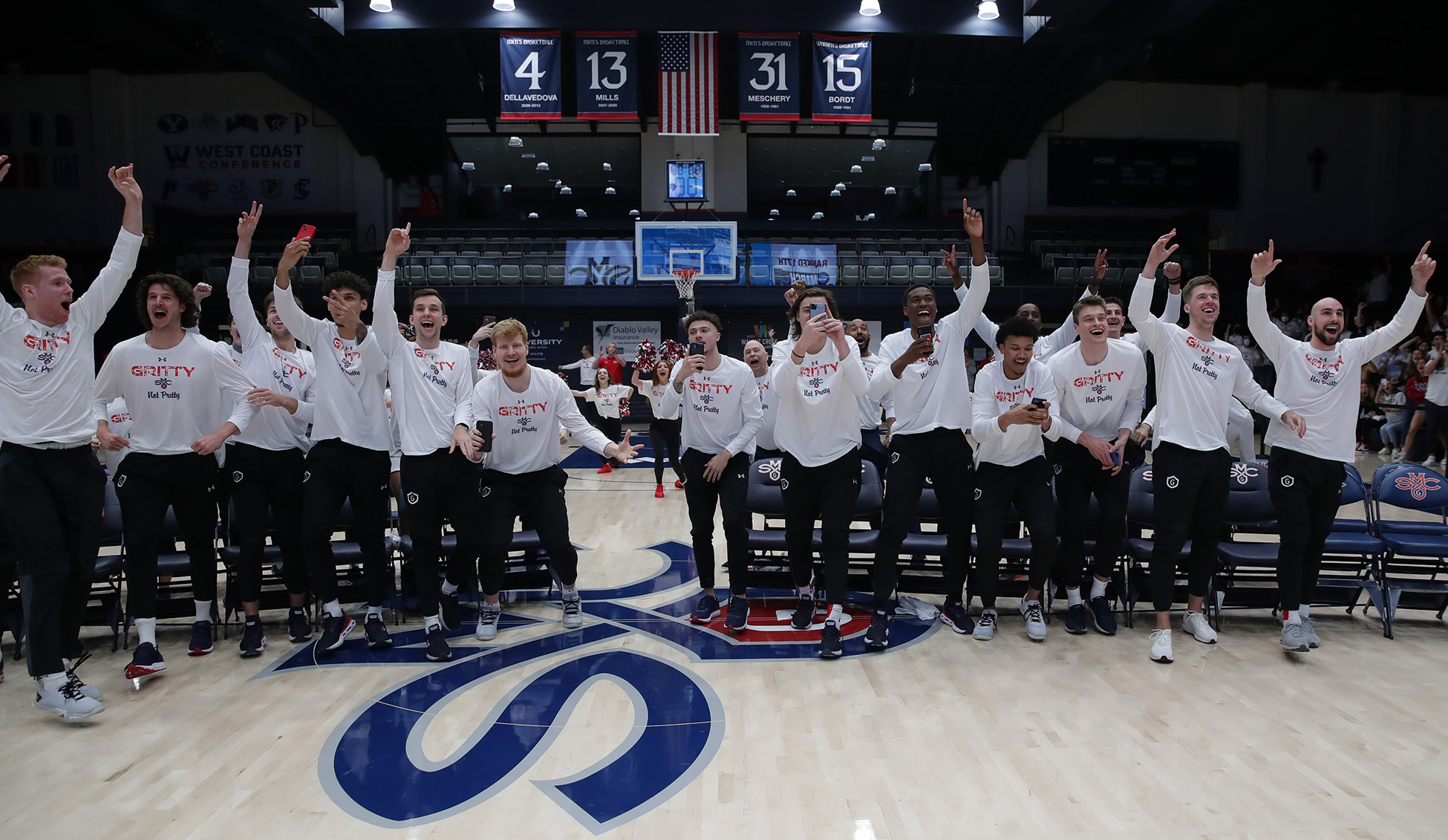 Saint Mary's Men's Basketball team cheers at 2022 NCAA Selection Sunday Watch Party