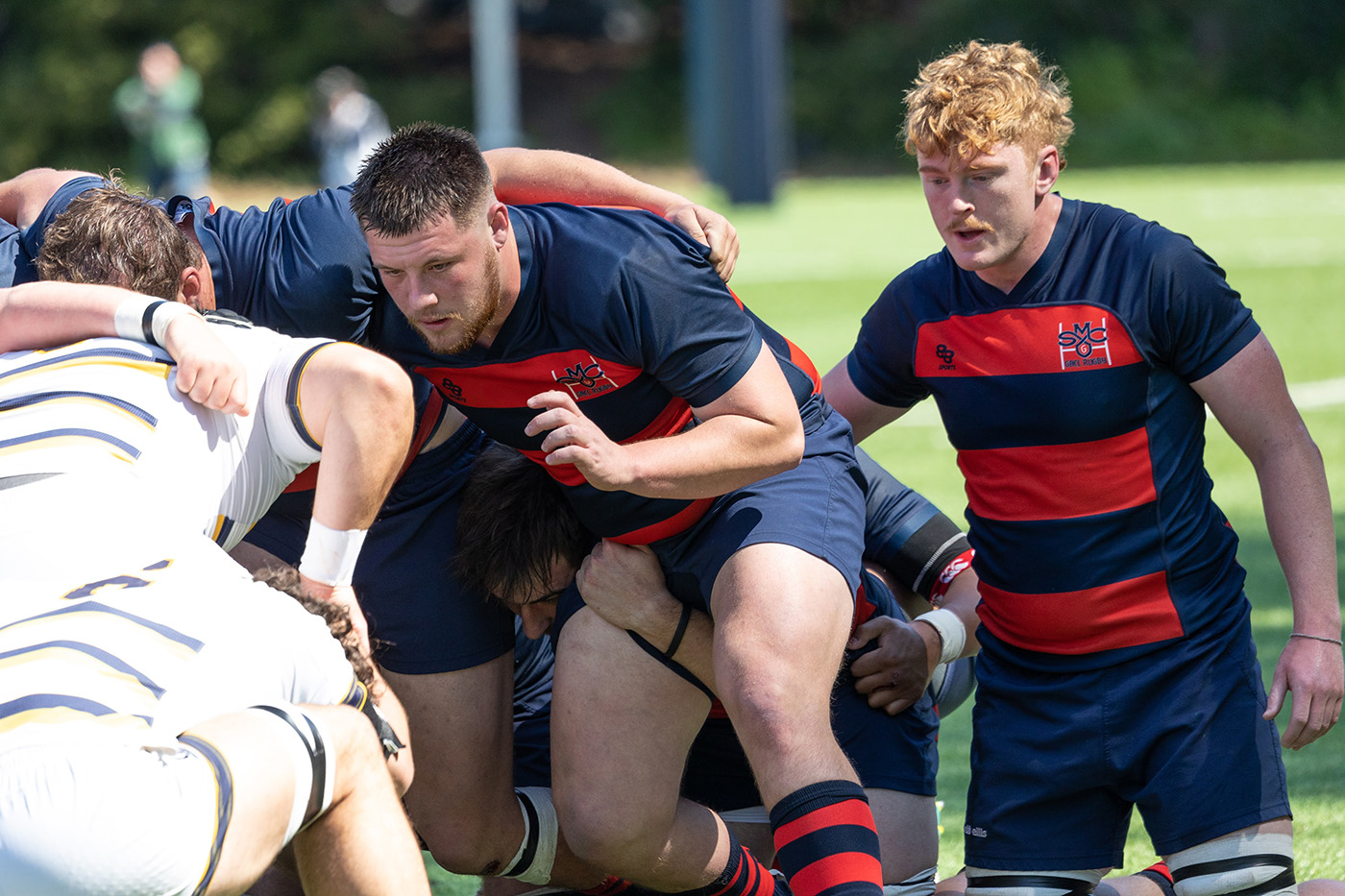 Saint Mary's rugby players Hunter Chuhlanrtseff on the left and Ronnie McElligott on the right prepare for a scrum against UC Berkeley March 25, 2023
