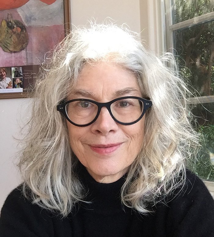 Headshot photo of Prof. Brenda Hillman in front of a window