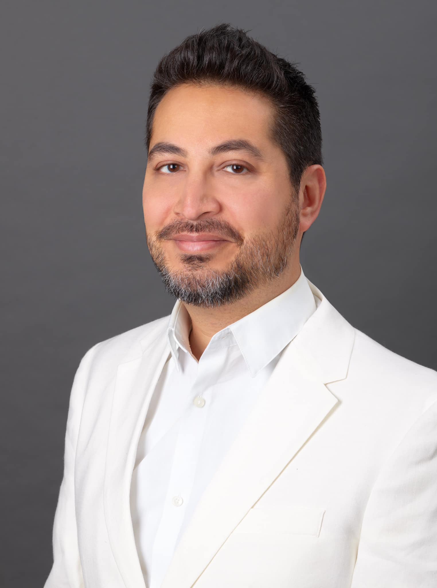 portrait of faculty wearing all white