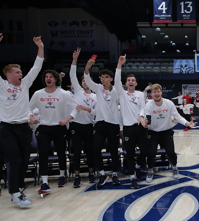 Men's Basketball players celebrate after Saint Mary's learns its placement in the NCAA tournament in 2022