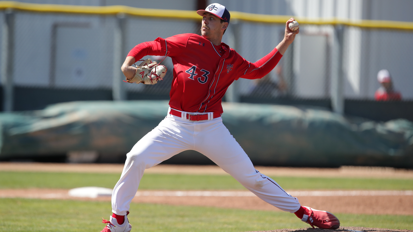 Ky Bush of SMC Baseball throwing a pitch