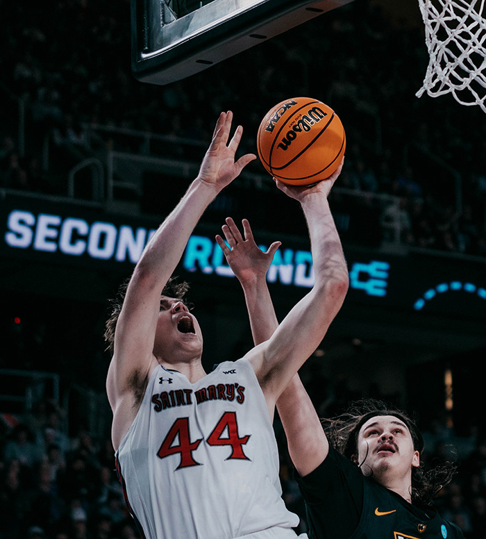 Basketball player Alex Ducas shoots against VCU on March 17 2023