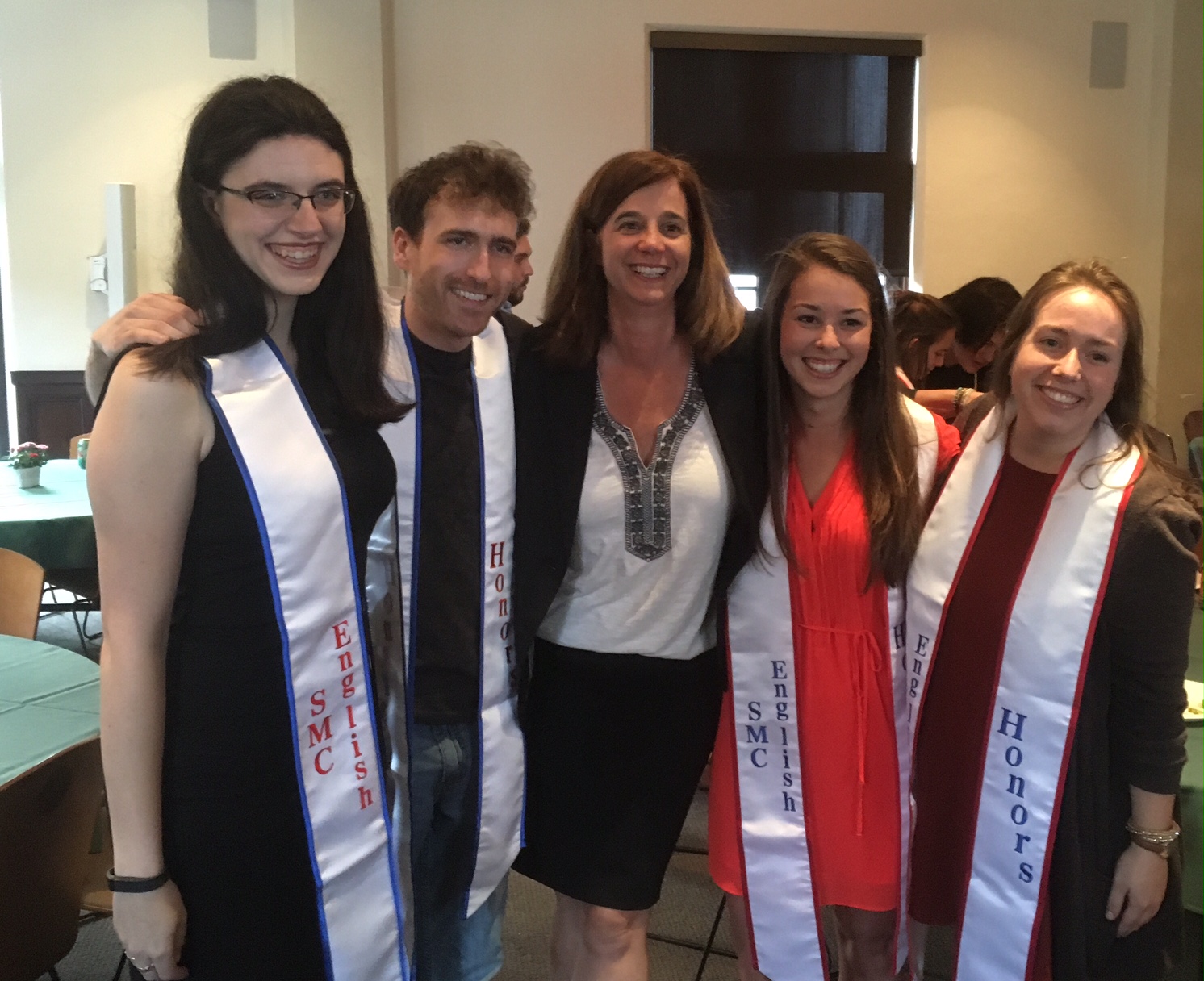 Group of five English Graduates standing with their professor