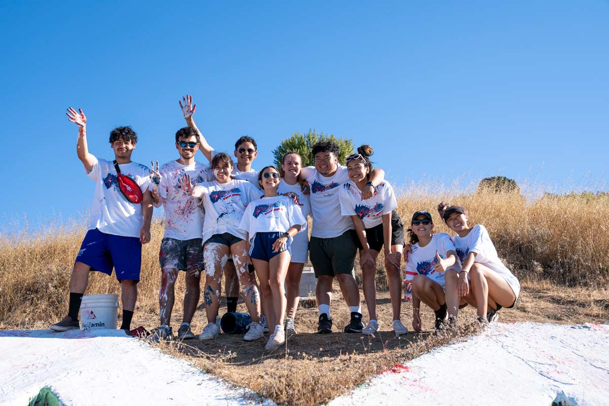 Students standing together after painting the SMC