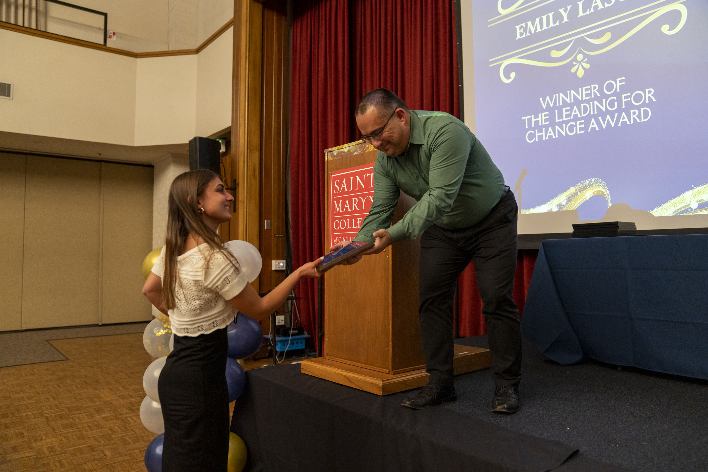 Dr. James Sciuto Hands the Student Leader award to the receipient