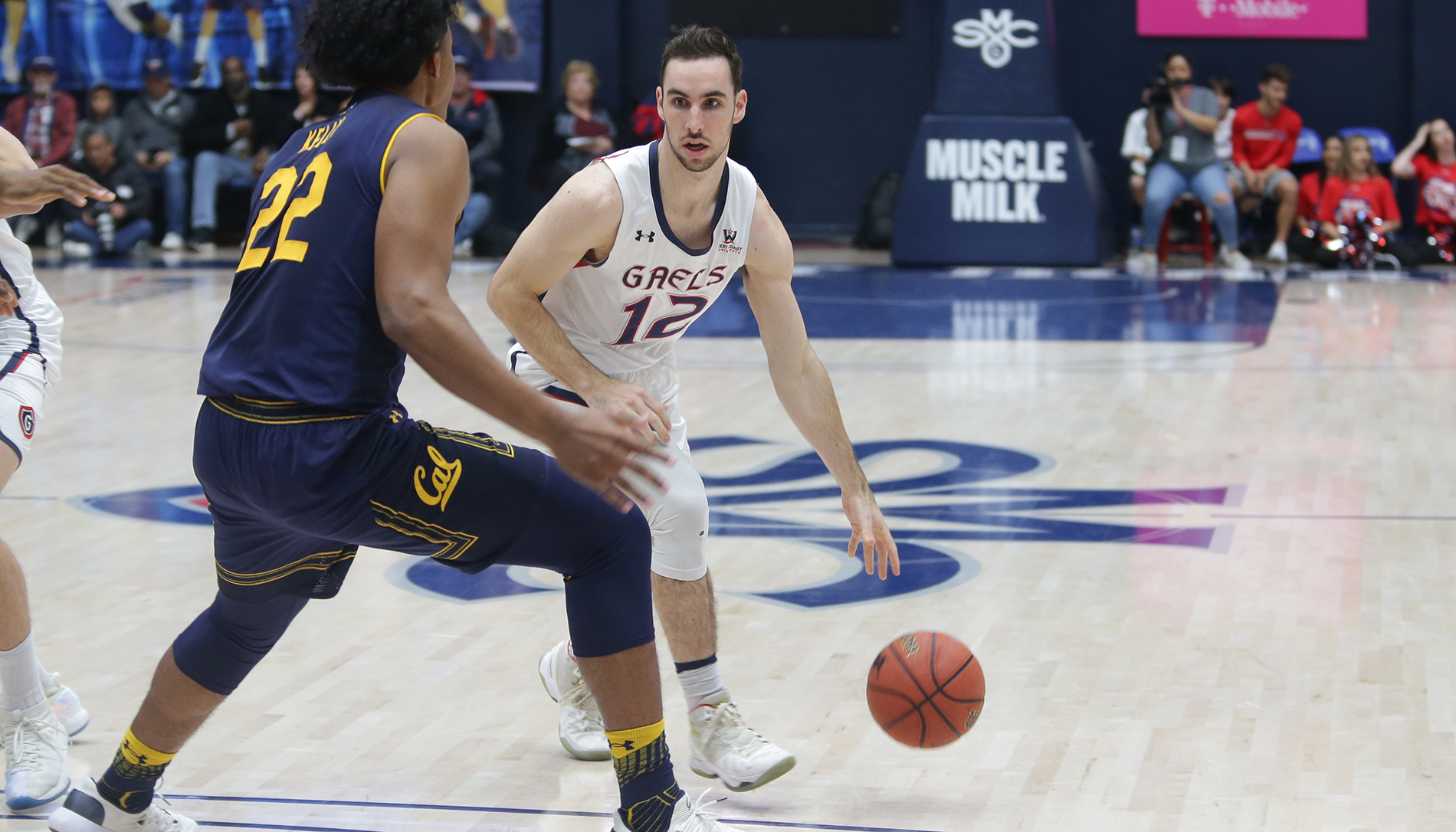Basketball player Tommy Kuhse faces a player from Cal