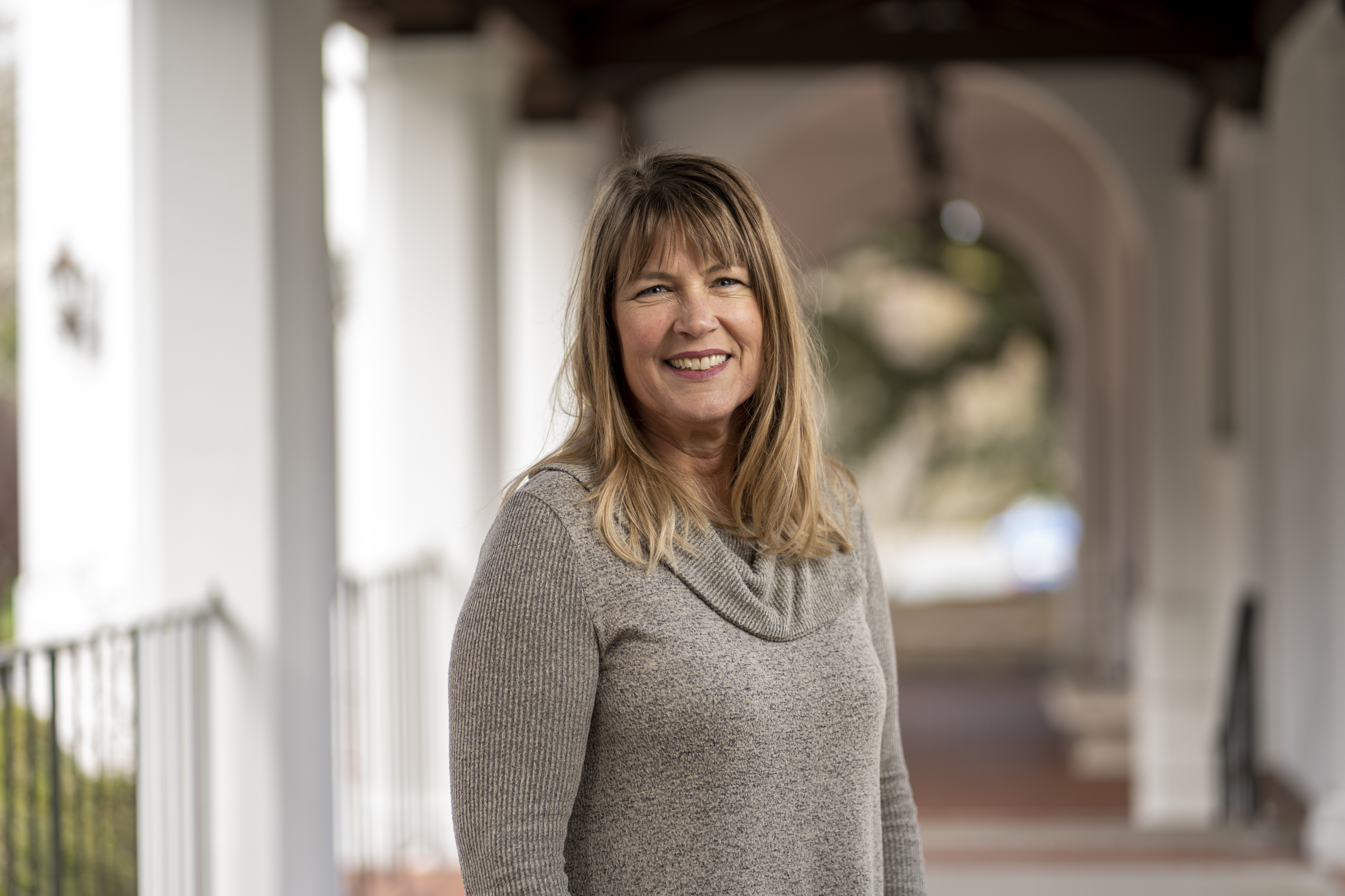 KSOE Admissions counselor Lucy Eger standing in the chapel breezeway