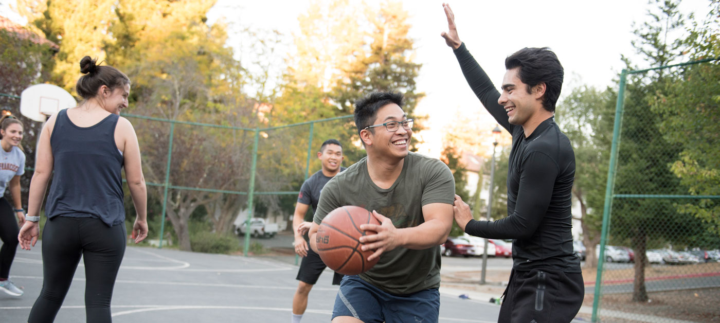 Transfer Students playing basketball