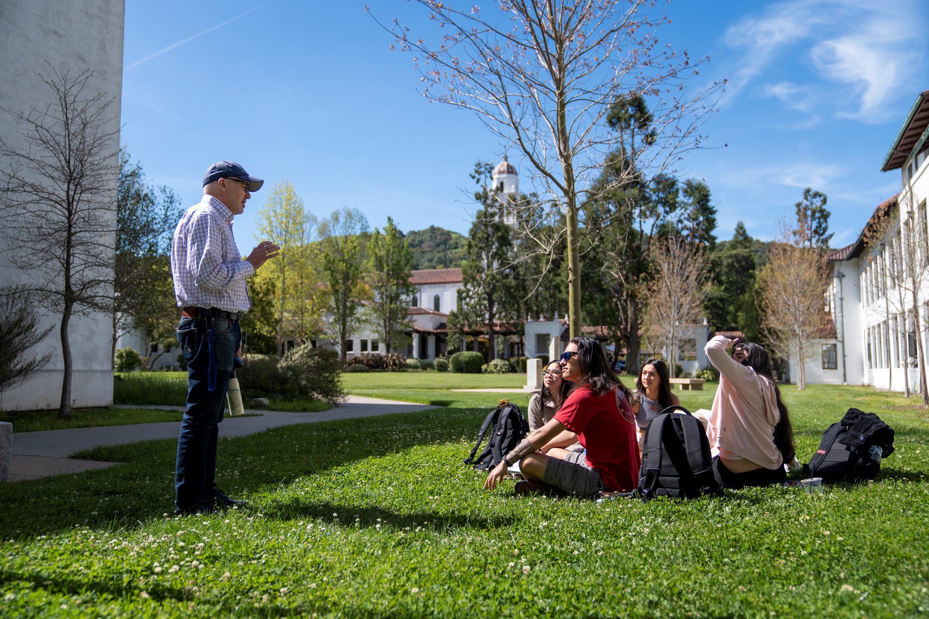 Students and faculty member outside