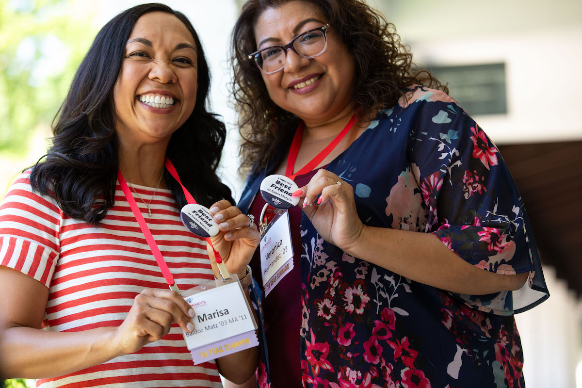 Marisa Soto Baldoz and Veronica Hernandez, class of 2003, show their &quot;best friend&quot; buttons at Reunion 2023
