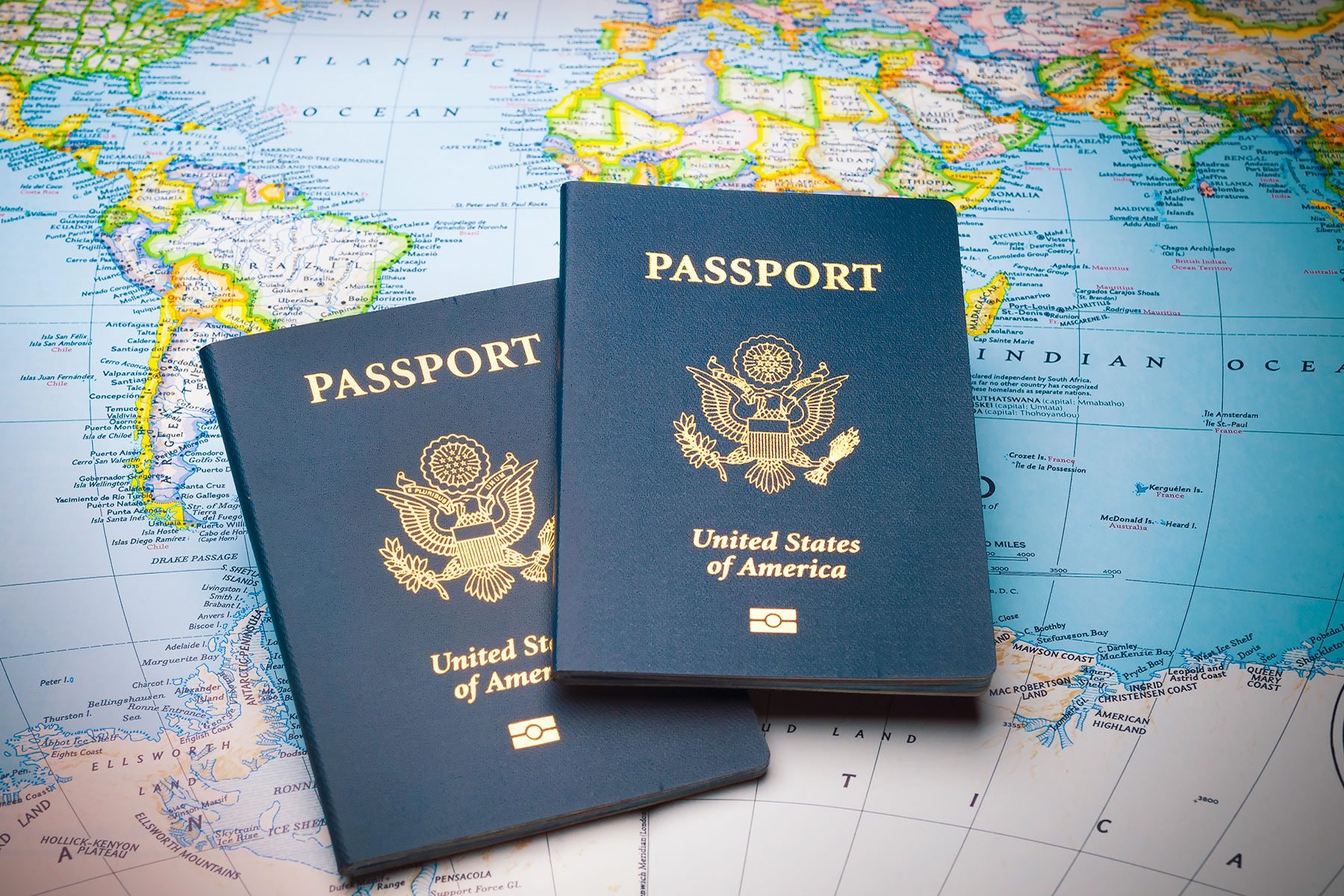 Two passports on a world map