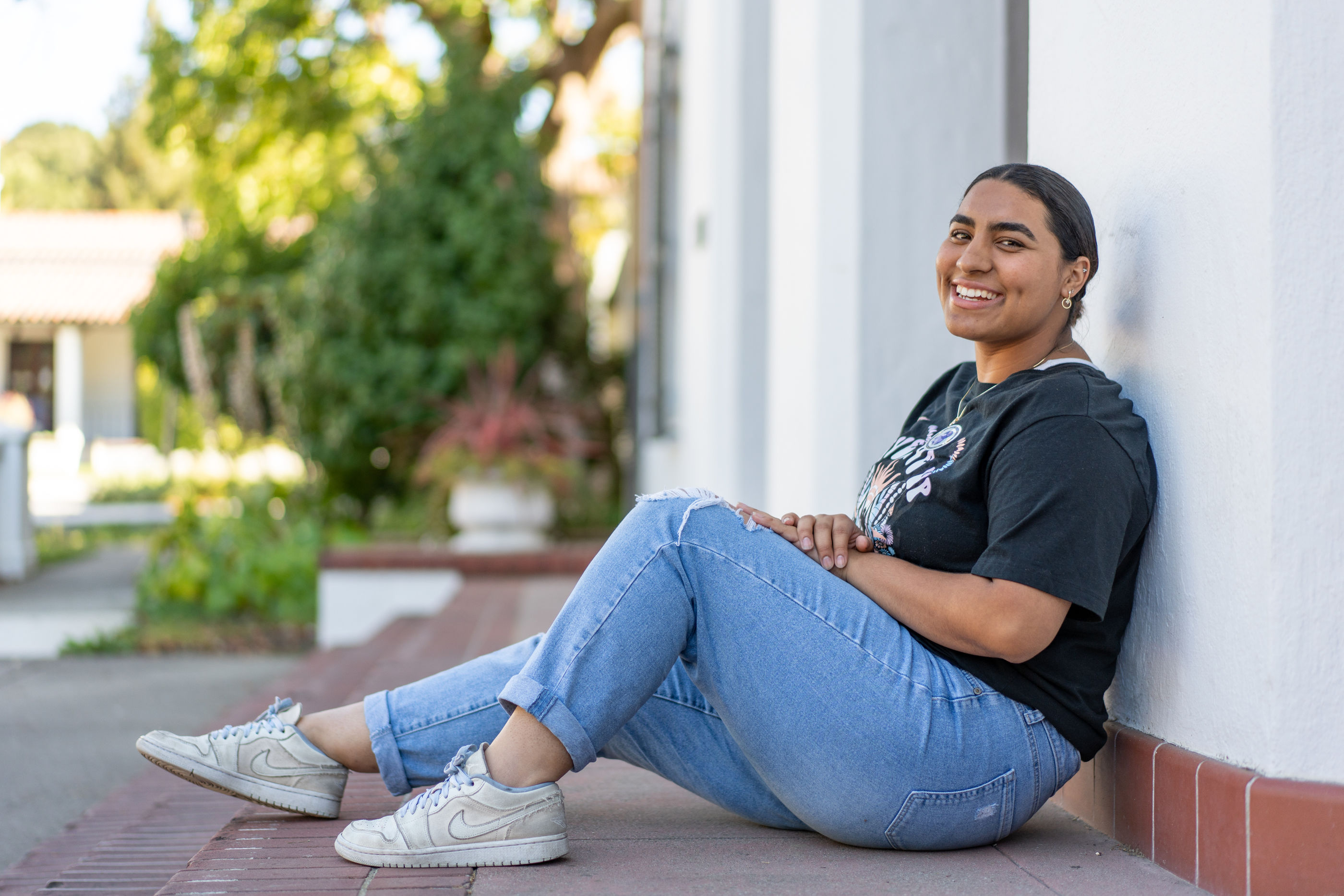 Rebecca Carranza seated on the chapel steps