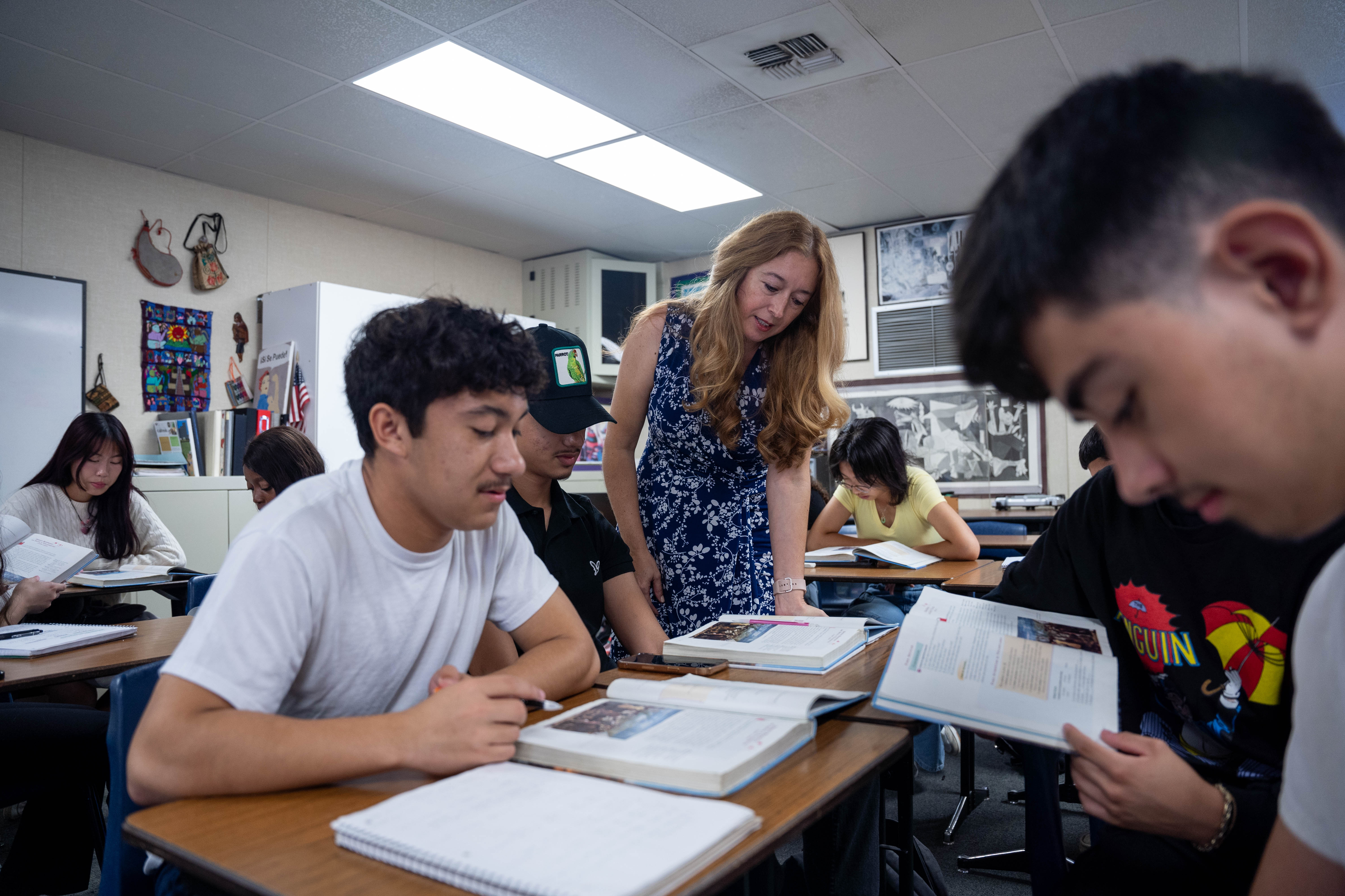 Annalouisa Gonzalez-Ortega works with students at their desks