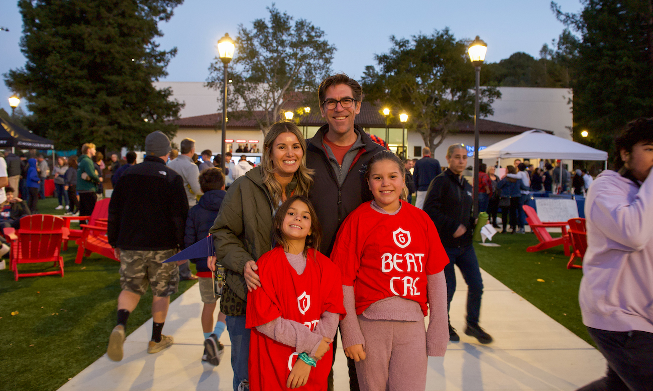 A family poses for picture at the 2022 Homecoming Fan Fest