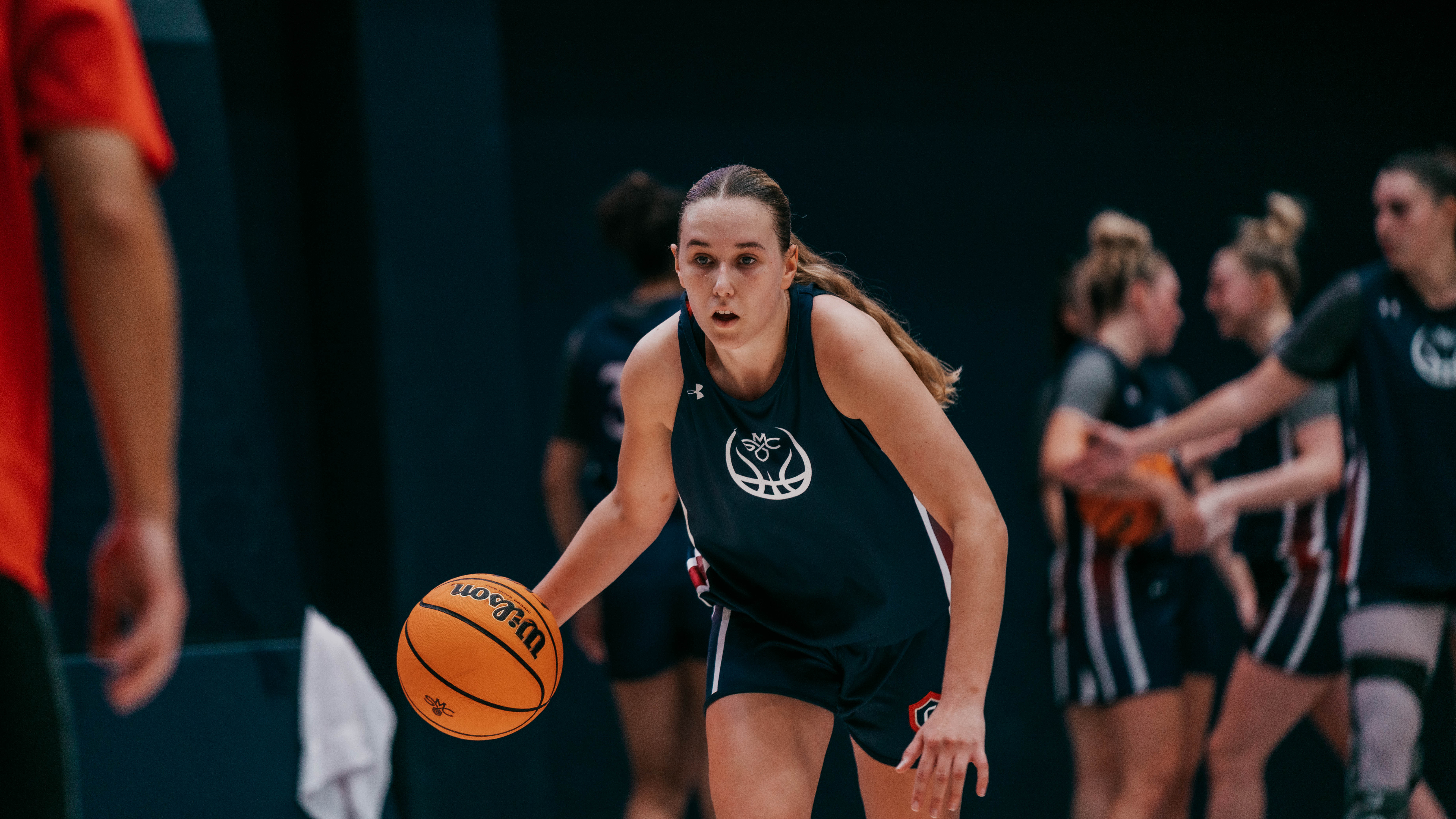 Emily Foy dribbles at practice