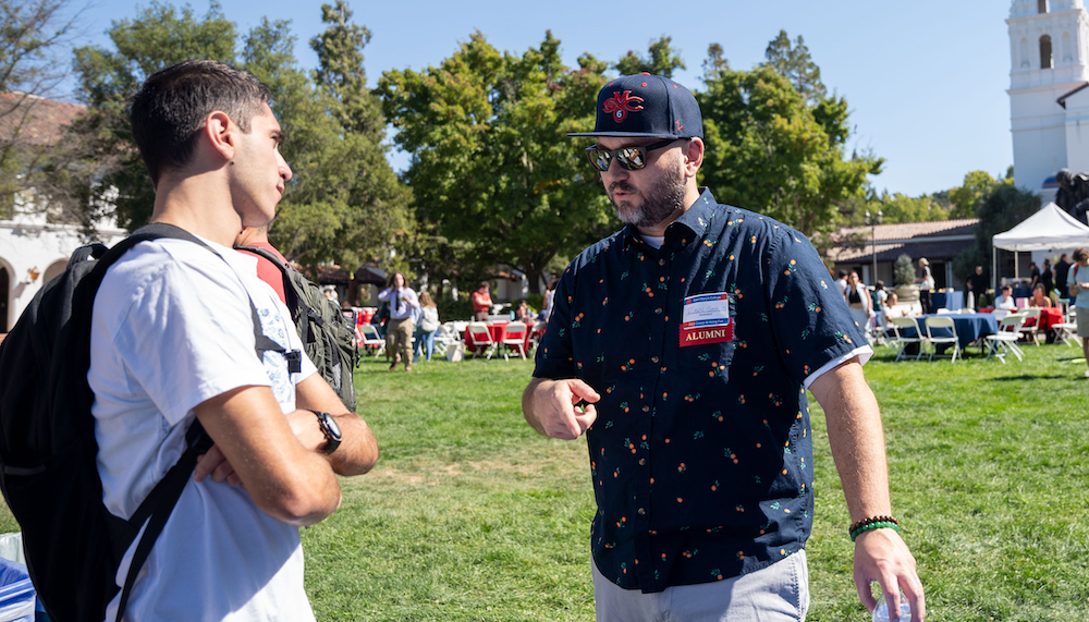 Ruben Garcia of Genentech talks with a Saint Mary's student in Fall 2023