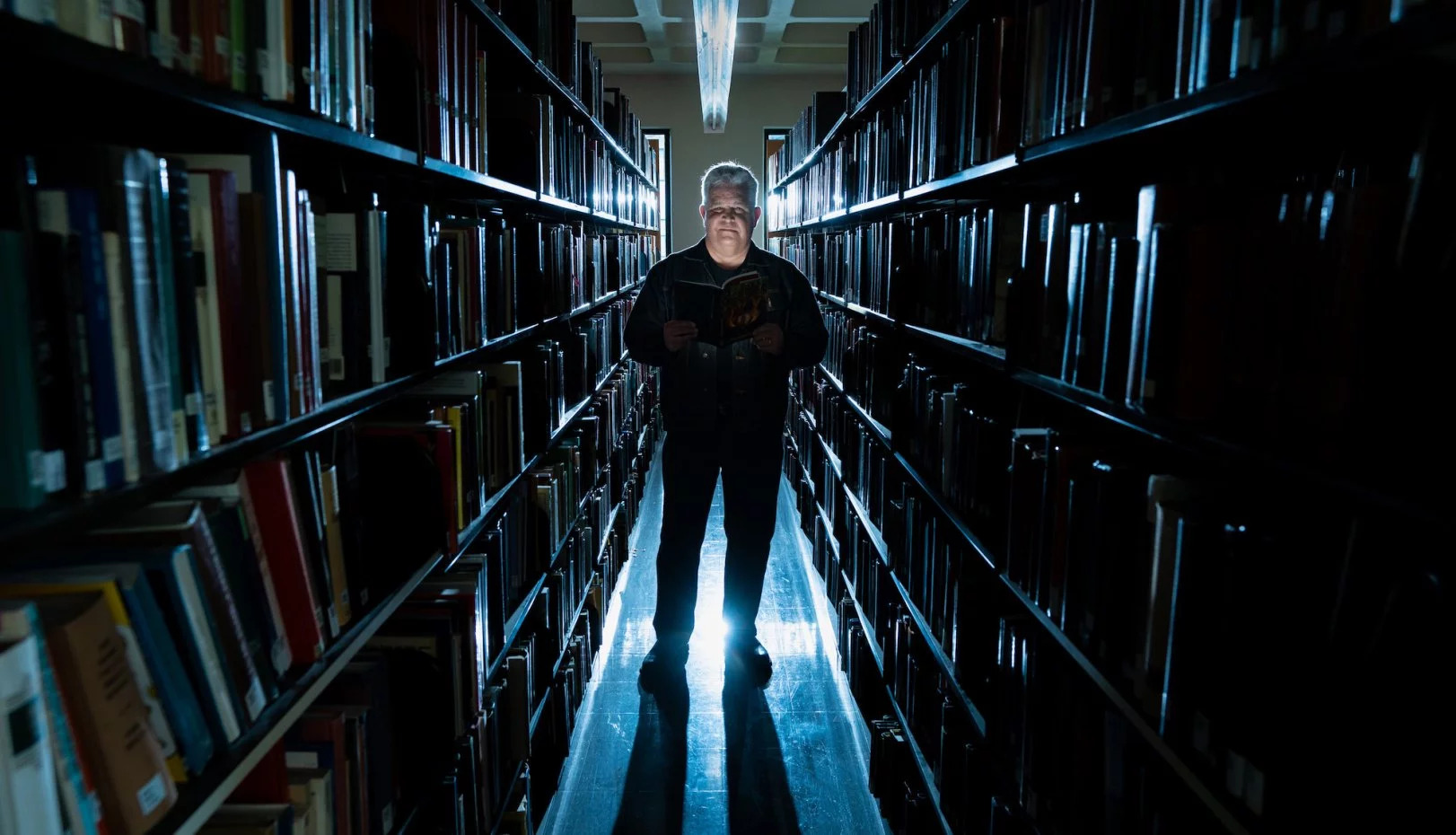 Norm Partridge in Library Stacks - Lede.jpg