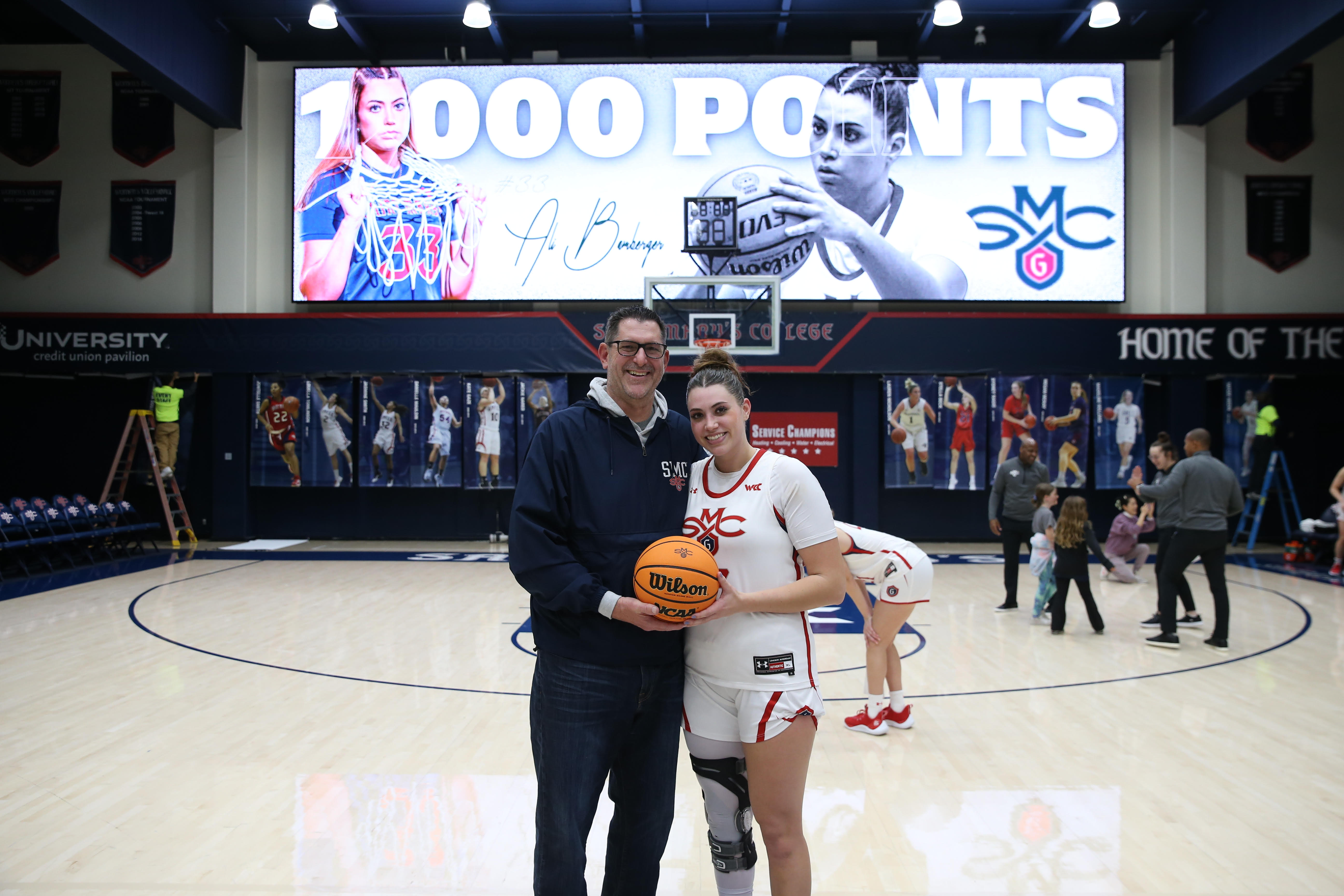 Ali Bamber '24 and her father Eric Bamberger '92 on the court