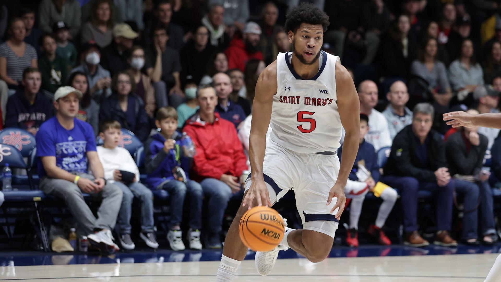 Men's Basketball player Joshua Jefferson drives against Portland in January 2024