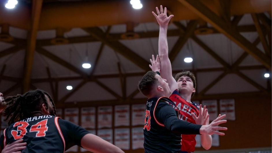 Men's basketball player Alex Ducas shoots against Pacific in February 2024