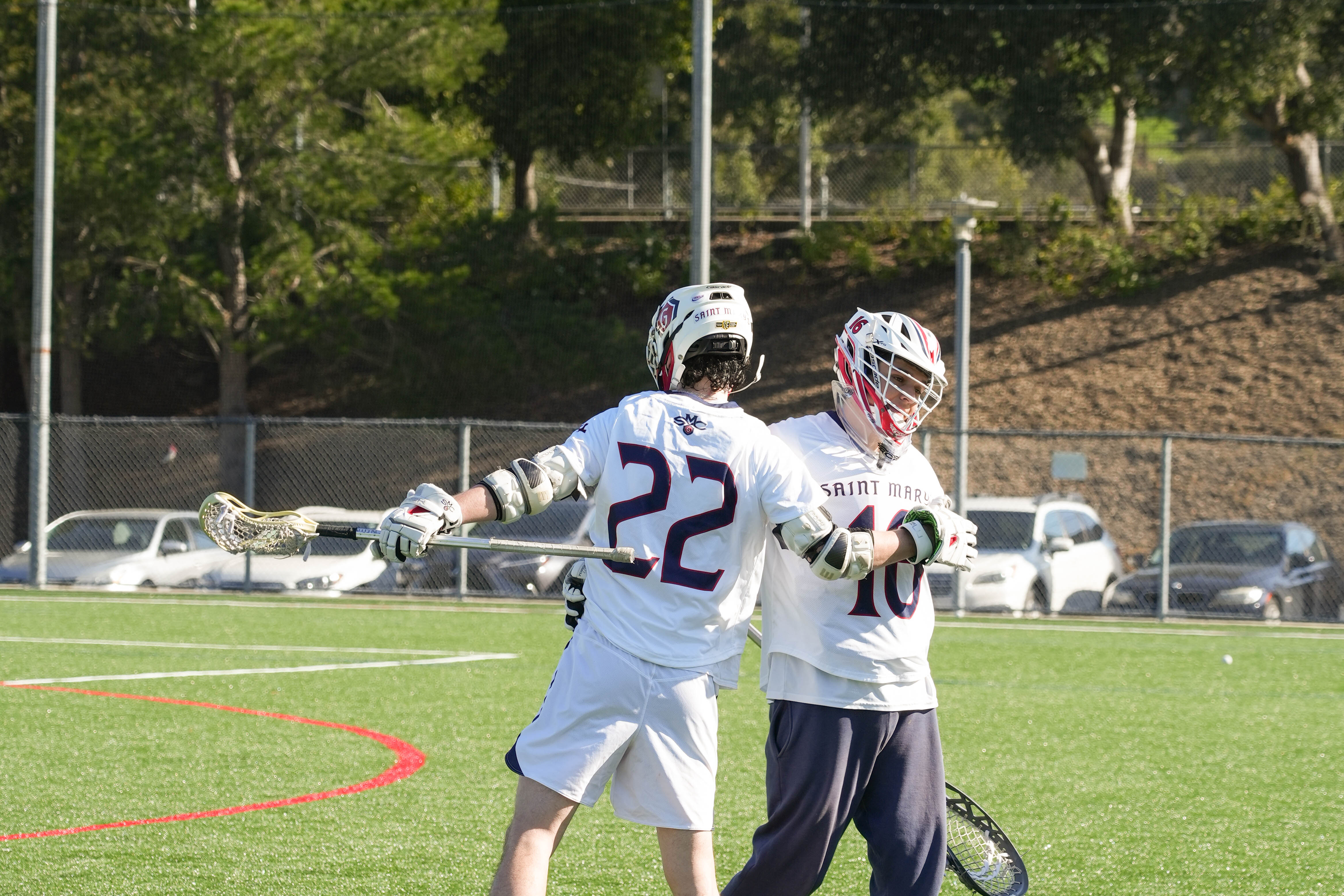 Team Success: #22 Chase Parker & #16 Ben Kellogg congratulate each other after the win against Cal Poly Humboldt on Saturday, February 24 . /Photo By Dominico Russo ‘24