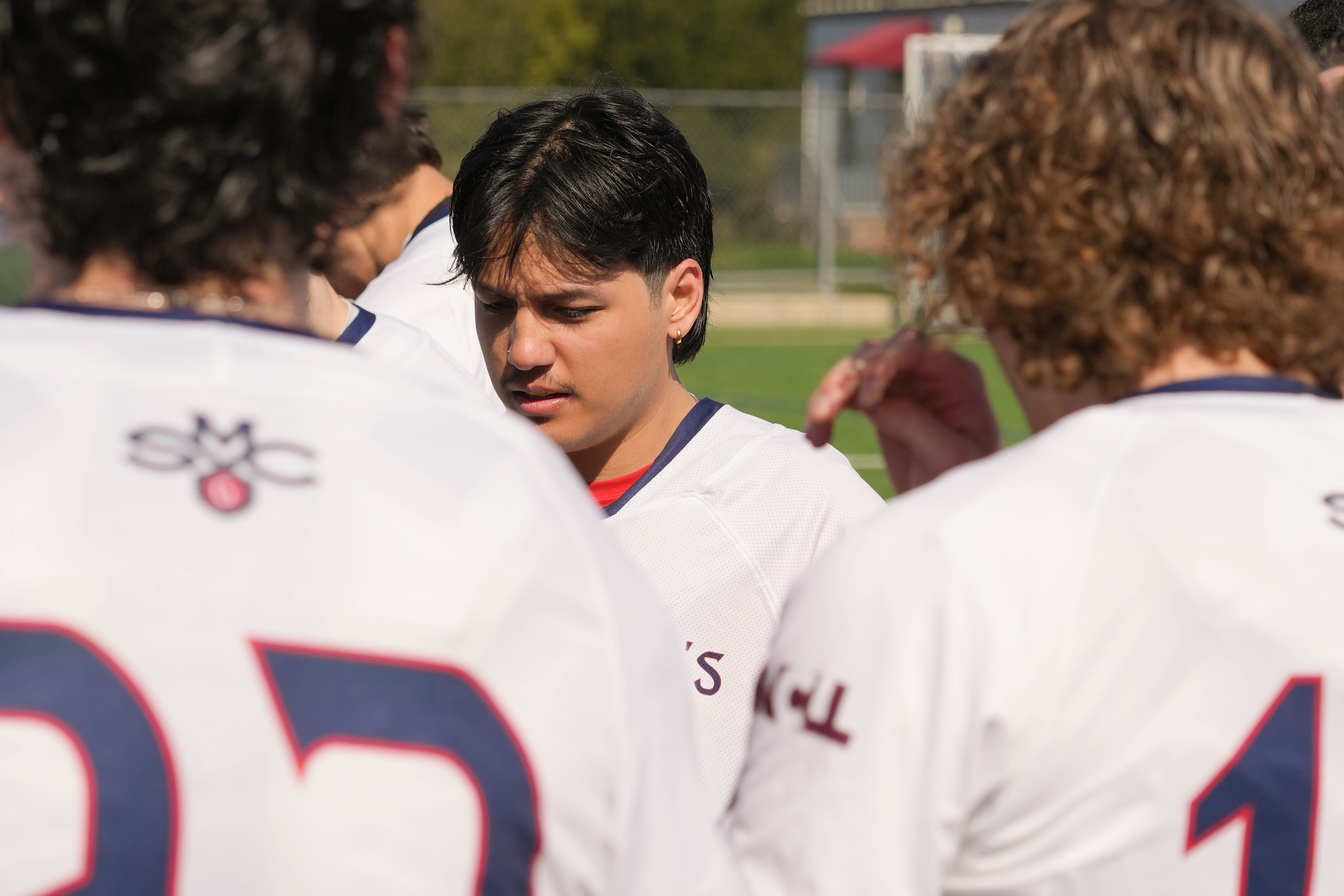 Pondering Thought: Senior Jared Ralleta ‘24 huddled up with his team during half time. 